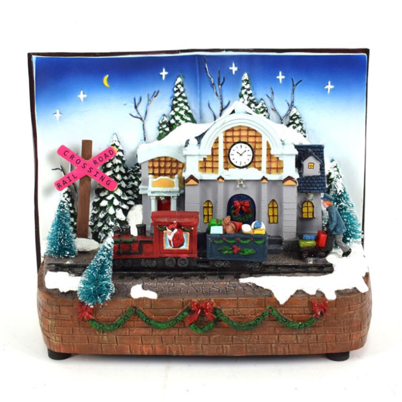 Aurora Store Villaggio Scenario Natalizio LIBRO con STAZIONE TRENO Natale in Movimento con luci e Musica 25x16x20 cm